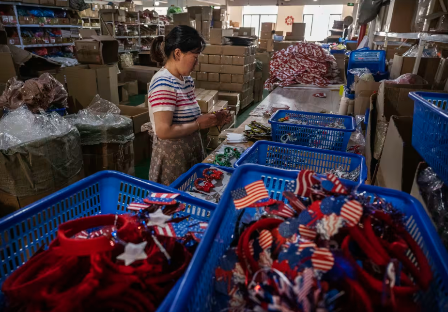 Can the Trump team and Beijing make progress on a trade deal? Here, a worker is shown at a factory in the Chinese city of Yiwu that makes patriotic American items for export to the U.S. market.