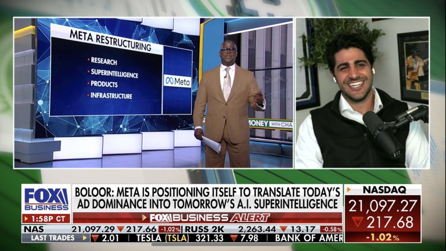 Split-screen TV broadcast from Fox Business showing a man in a brown suit speaking at a podium labeled Meta with text overlays for research superintelligence and supervision alongside a man in a gray vest at a desk with microphone and another image of a smiling man in the background stock ticker displays NASDAQ values for META at 21.70 percent change and other companies like TSLA and Bank of Amer.