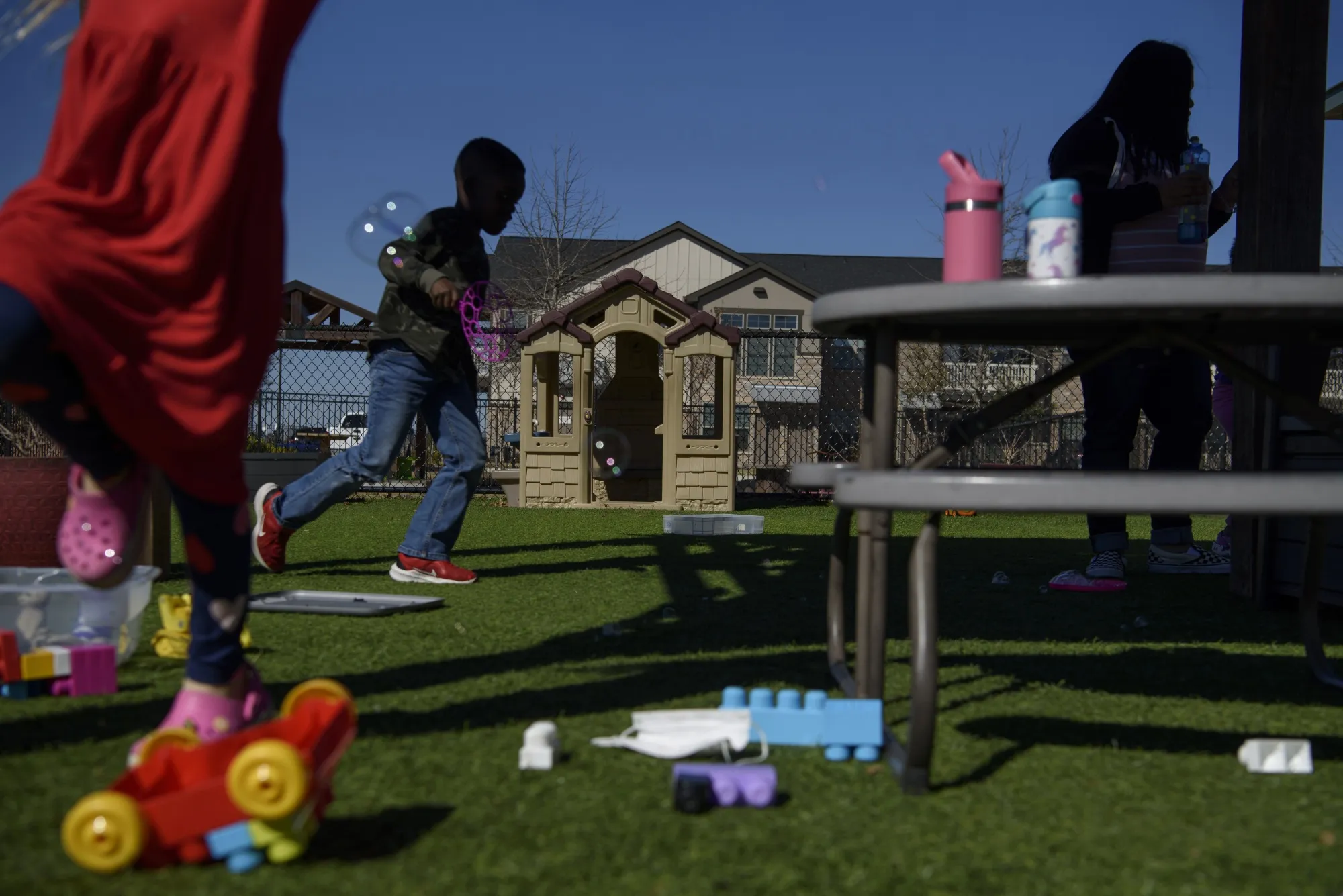 Children play on the playground of a daycare center in Texas.