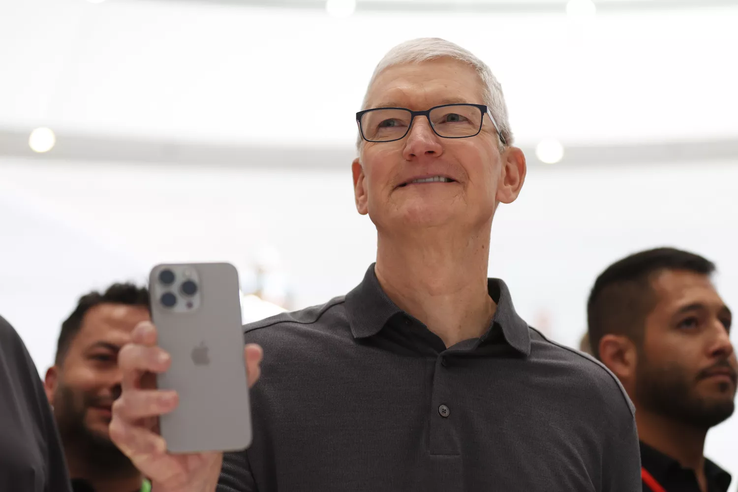 Apple CEO Tim Cook holds up a new iPhone 15 Pro during an Apple event on September 12, 2023.