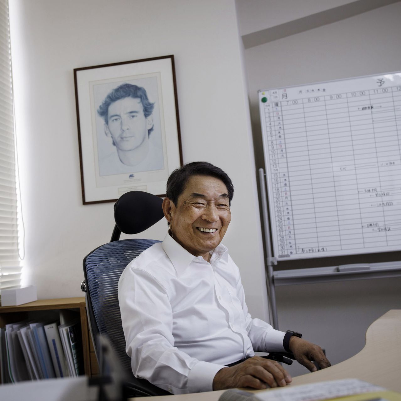 Shoichiro Irimajiri, the former head of Sega, in his Tokyo office today. Behind him is a photo of his friend Ayrton Senna, the late Formula One champion