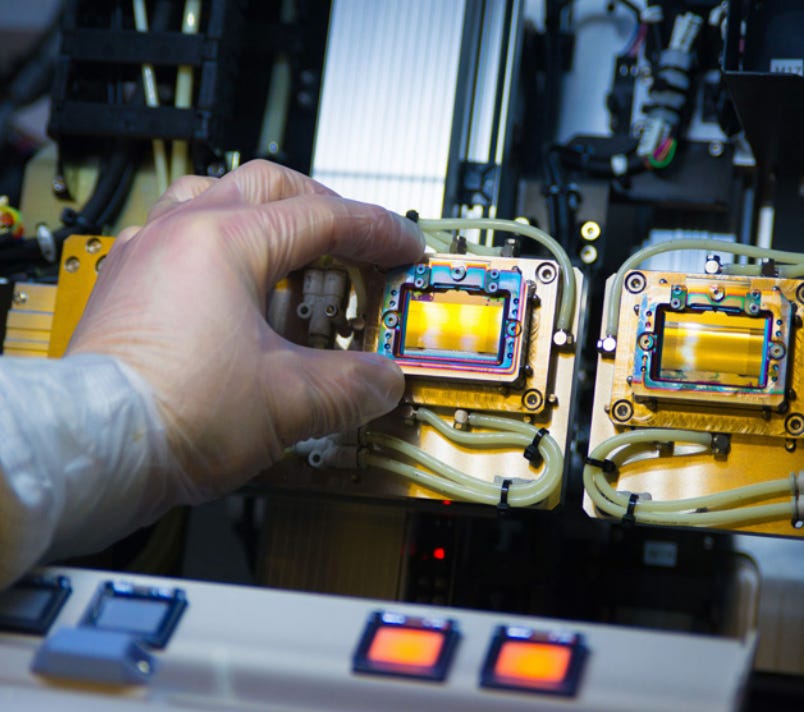 A person holding a piece of electronic equipment

AI-generated content may be incorrect.