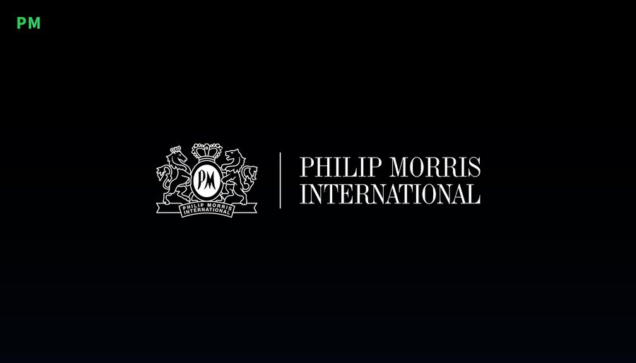 Black background with white Philip Morris International logo featuring a crowned emblem on the left and the company name text on the right, accompanied by a green PM ticker symbol in the bottom right corner.