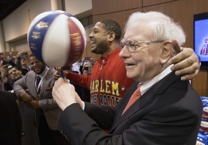 Guests at Berkshire Hathaway’s 2013 annual shareholder meeting included Harlem Globetrotter Chris ‘Handles’ Franklin and Detroit Lions’ Ndamukong Suh.