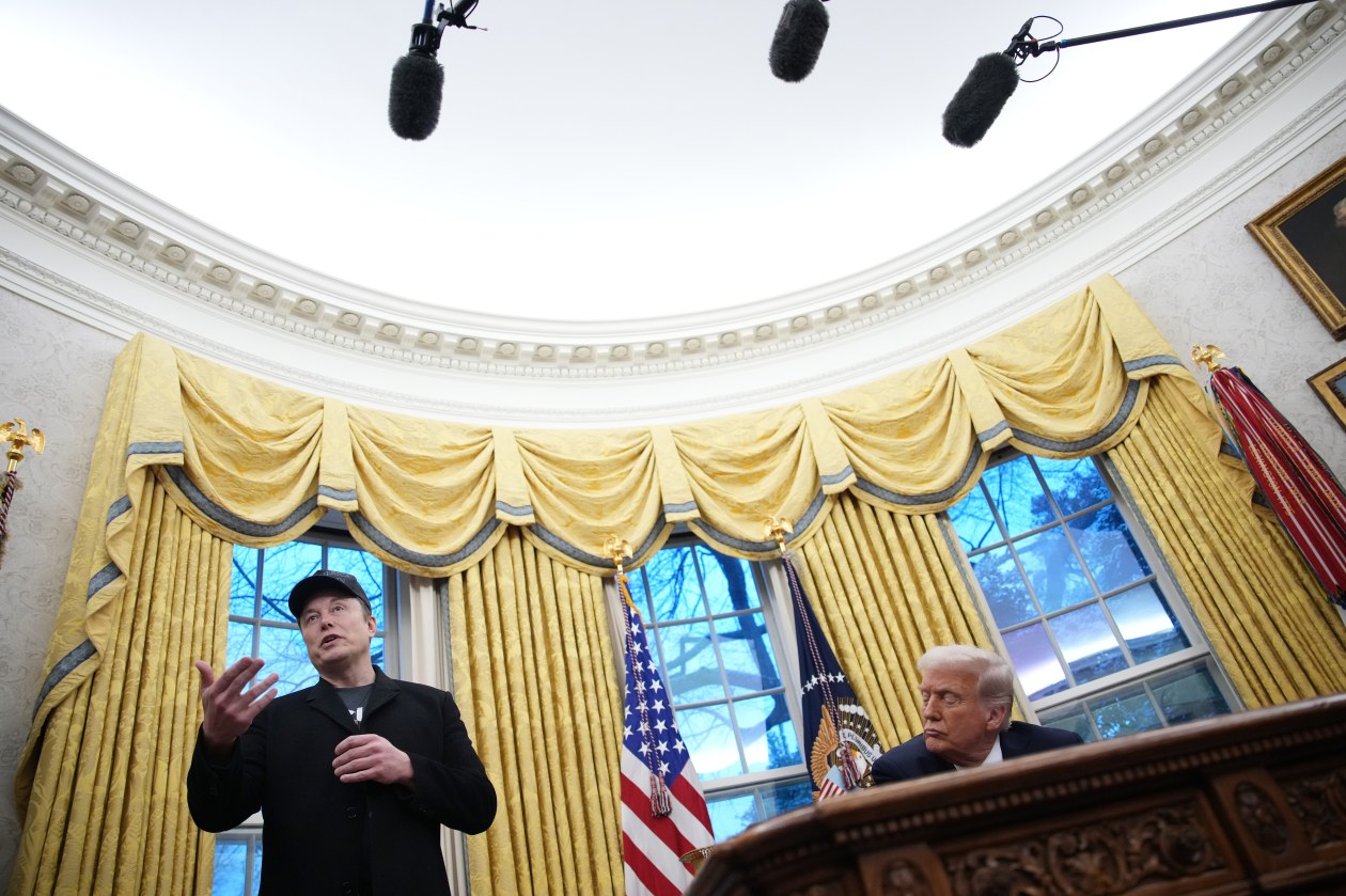 Elon Musk delivers remarks next to President Donald Trump in the Oval Office.