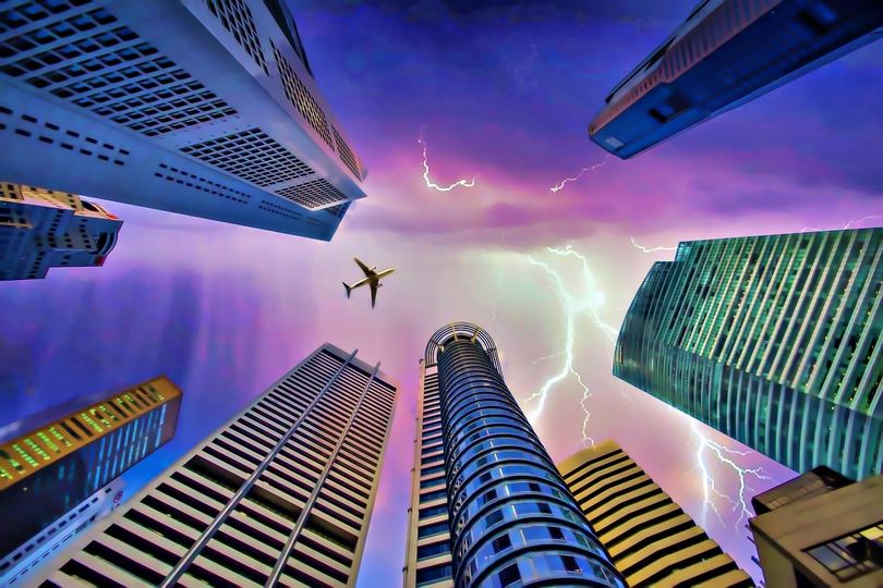May be an image of helicopter, lightning and skyscraper