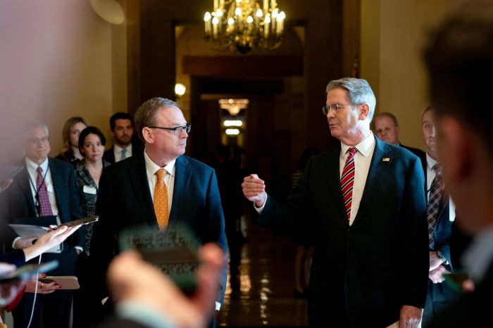 Kevin Hassett and Scott Bessent speaking to reporters at the US Capitol.